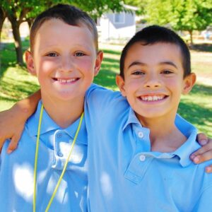 two happy students smiling