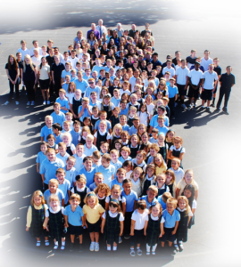 Children standing in a cross shape