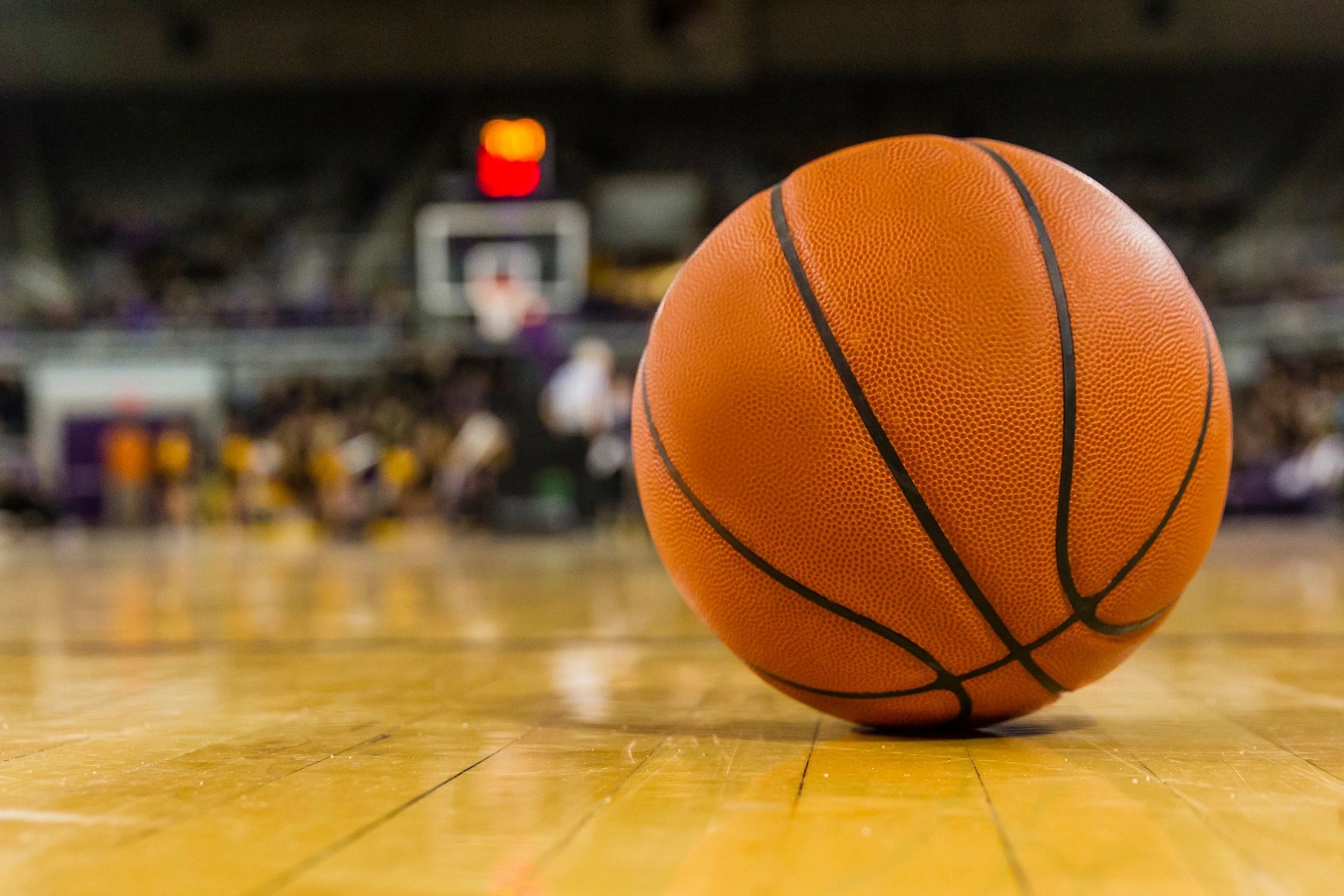 photo of a basketball on the court